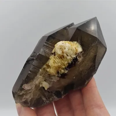 Natural smoky quartz - double crystal, overgrown with tourmalines, albite. A very interesting aesthetic collector's piece.