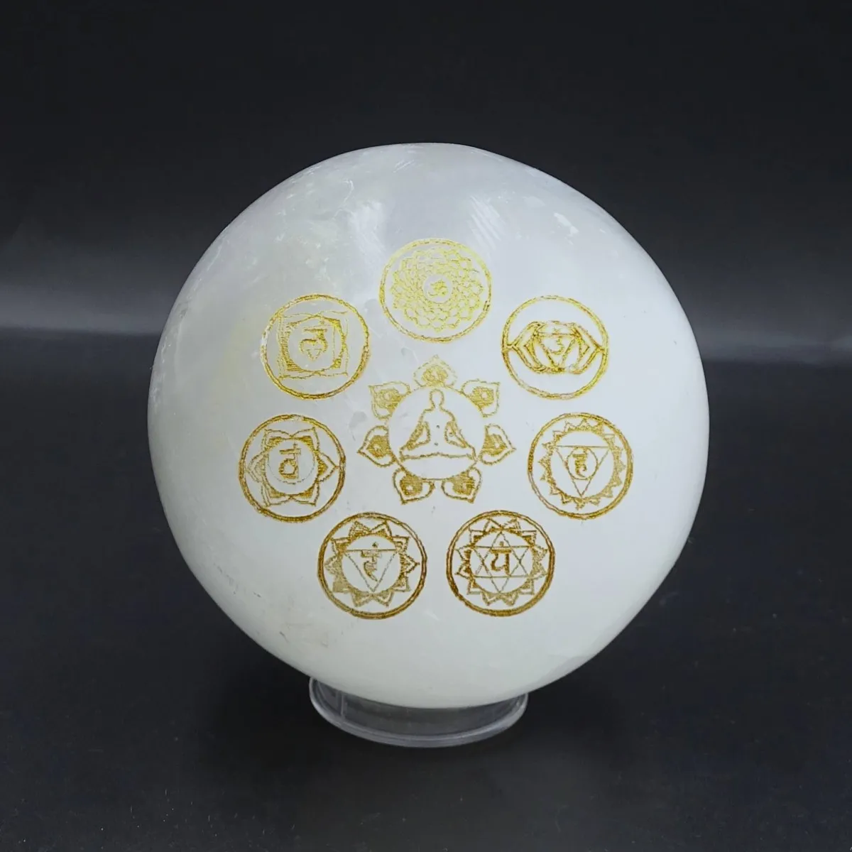 Selenite balls with chakra symbols 582g, Morocco