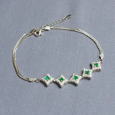 Silver bracelet with emeralds and zircons