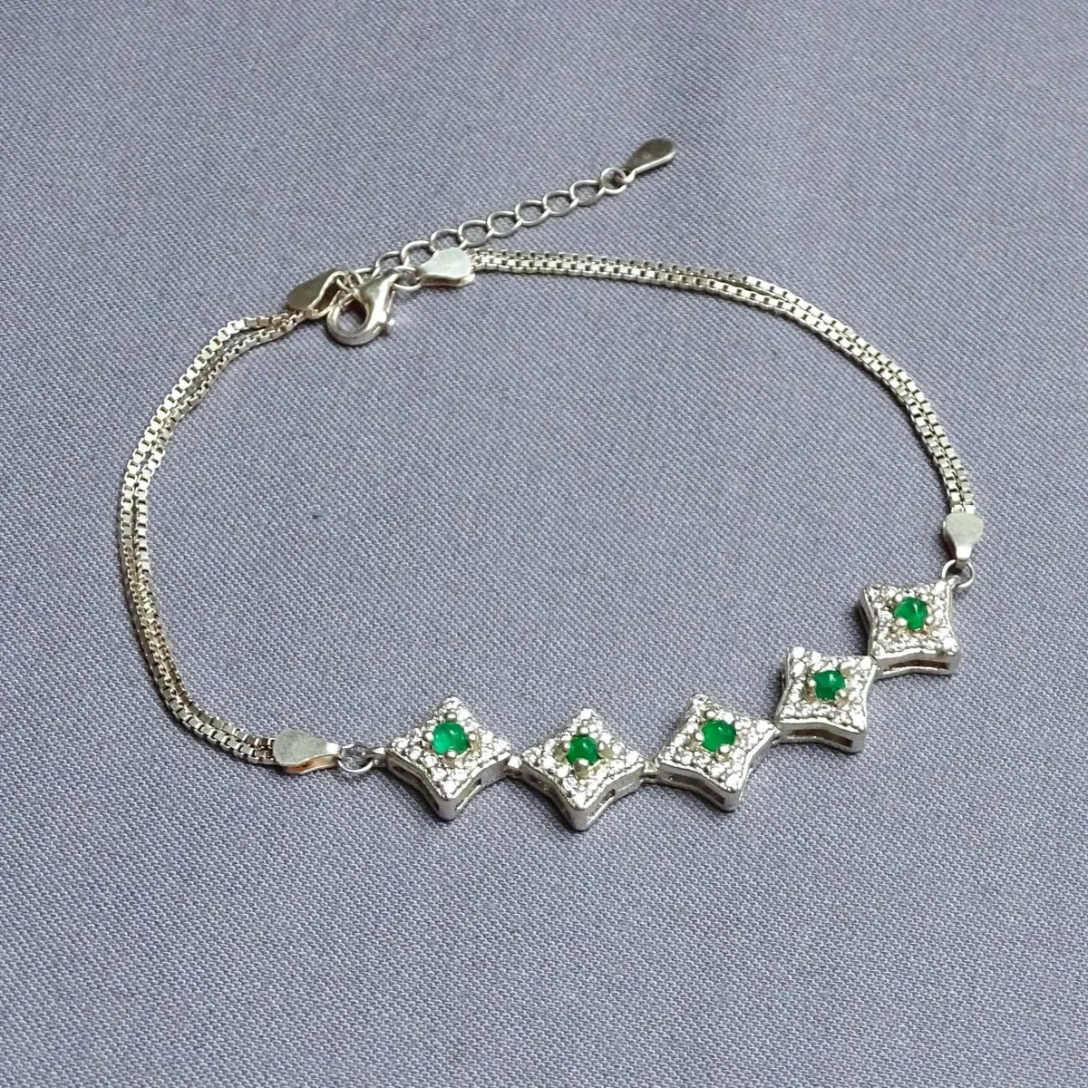Silver bracelet with emeralds and zircons