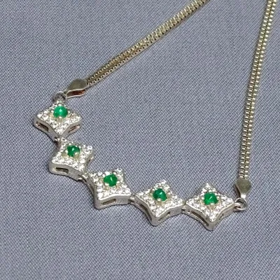 Silver bracelet with emeralds and zircons