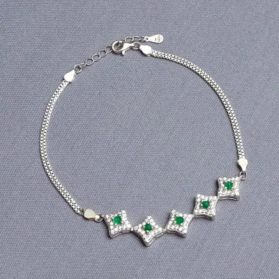 Silberarmband mit Smaragden und Zirkonen